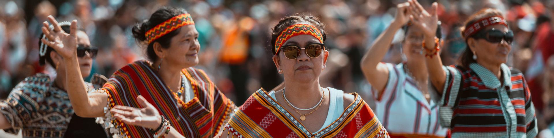 Several women dance at the Canada Day parade.