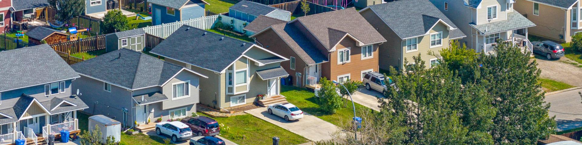 Single family houses line a street in Fort St. John.