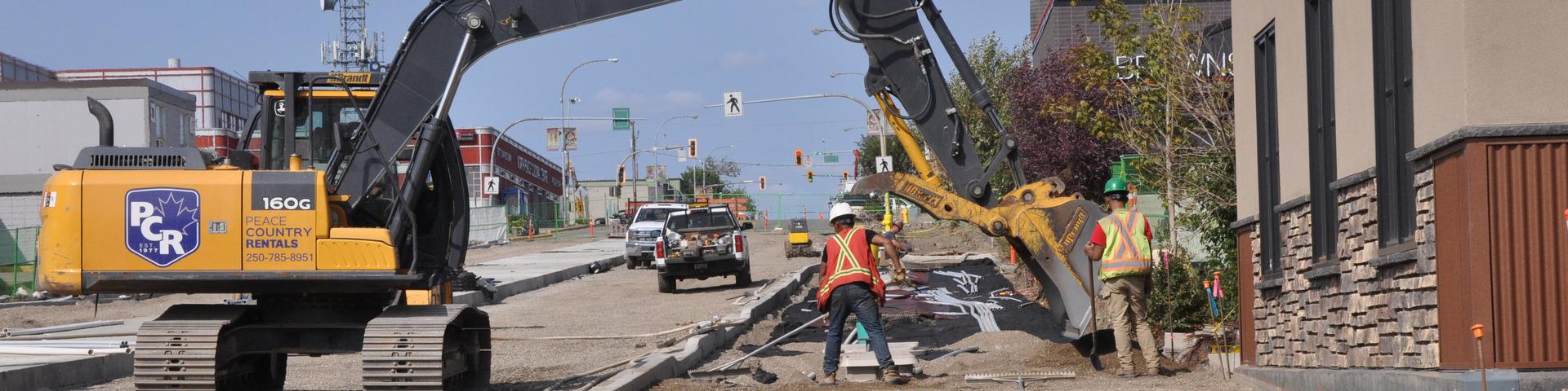 Construction crews work on 100 Street.